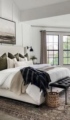 a large bed sitting in a bedroom on top of a floor next to a window