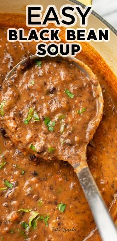 an easy black bean soup in a pot with a spoon