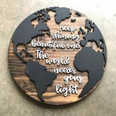 a wooden sign that says, keep shining beautiful one the world needs your light on it