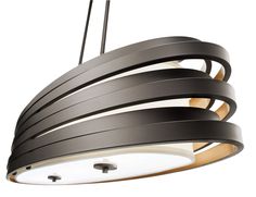 a black and white light hanging from a ceiling fixture with wood strips on the side