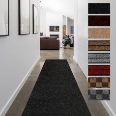 a long hallway with carpeted floors and pictures on the wall