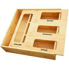 a wooden tray with four compartments for different things to put in it, and the words quart on each compartment