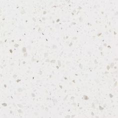 a white counter top with small speckles on it