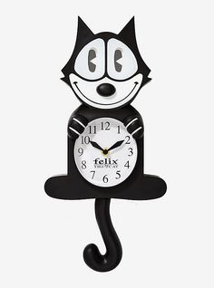 a black and white clock with a cat face on it