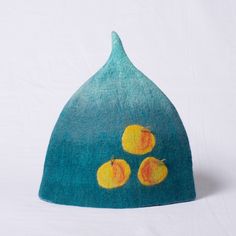 a blue hat with oranges painted on it