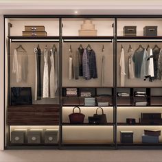 an open closet with clothes and handbags on shelves