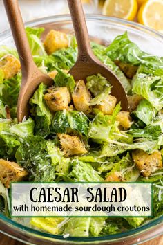 caesar salad with homemade sourdough croutons in a glass bowl