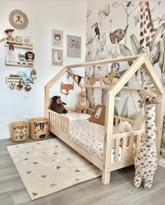 a child's room with stuffed animals on the wall and toys in the bed