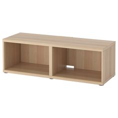 a wooden shelf with two open compartments