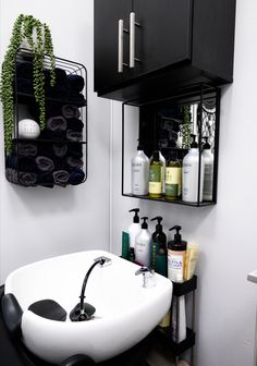 A sleek, modern salon suite shampoo area with a touch of luxury and comfort. Hair Sink Salon, Towel Storage Salon, Small Salon Suite Ideas Black, Small Salon Wash Station Ideas, Home Salon Shampoo Station, Small Hair Salon Storage Ideas, Salon Revamp Ideas, 10x10 Salon Suite, 10x10 Salon Suite Layout