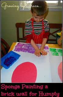 a young boy is painting a brick wall for humpty paint on the table