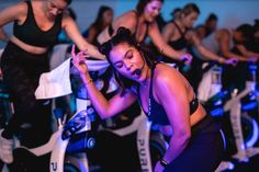 a group of women riding bikes on top of each other