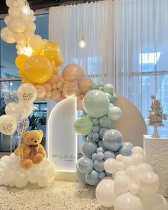 balloons are arranged in the shape of letters and teddy bears, along with other decorations