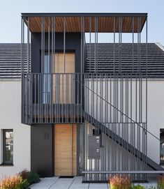 an apartment building with stairs leading up to it