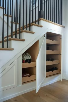 an under the stairs storage area with shoes