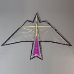 a kite that is hanging on the wall