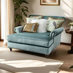 a living room with a blue couch and pillows