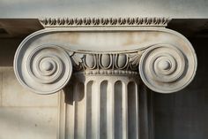 an old column with some decorative designs on it