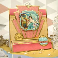 a close up of a greeting card on a table with other decorations and decor items