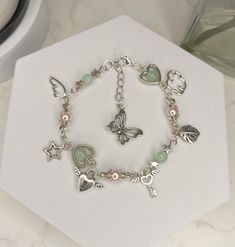 Bff Charm Bracelets, Shabby Chic Bracelets, Pretty Charm Bracelets, Aesthetic Green Accessories, Cute Bracelet Diy, Green Aesthetic Bracelets, Fairycore Aesthetic Jewelry, Beaded Bracelets Charms, Green And Pink Bracelet