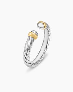 a silver and gold ring on a white background