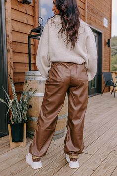 - These faux leather pants are cool, chic, and unique! - Unlined faux leather material - An adjustable, elastic cord drawstring waistline - A faux zip fly accent - Functional side pockets and back pockets - A relaxed silhouette that ends in ankle length drawstring hemlines Casual Brown Faux Leather Pants, Brown Faux Leather Joggers Outfit, Casual Brown High-waist Leather Pants, Brown Full Length Faux Leather Pants, Brown Faux Leather Full-length Pants, Black Curves, Impressions Online Boutique, Faux Leather Pants, Women Clothing Boutique