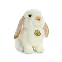 a white stuffed rabbit with brown ears