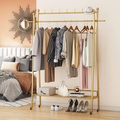 a clothes rack in a bedroom next to a bed with shoes on it and a mirror