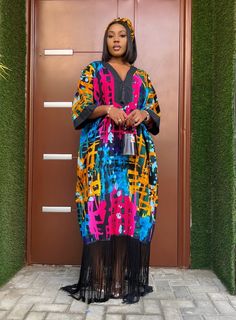 * Free size boubou  * Tassel detail  * Fringe hemline  * Fabric type- 100% Cotton Ankara  * Comes with a scarf  * Length: 62 inches  * Model is 5’6ft  Care Instructions: Hand wash/Dry Clean. Ankara Gown For Women, Free Gown Ankara Styles, Arewa Ankara Gown Styles, Ankara Bubu Gown, Ankara Bubu Gown Styles, Adire Dress, Bubu Gowns