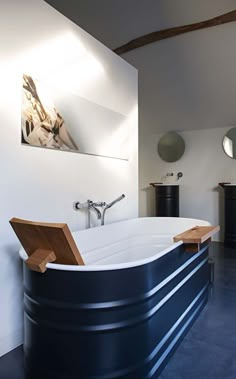 a large bath tub sitting in the middle of a bathroom