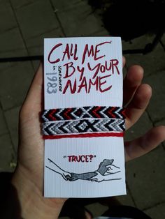 someone is holding up a business card that says,'call me by your name '