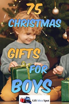 two young boys sitting in front of a christmas tree with presents on the floor and text overlay that reads 75 christmas gifts for boys