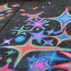 colorful chalk drawings on the ground with crayons