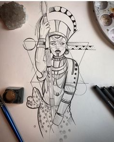 a drawing of an egyptian god on paper