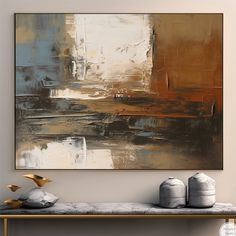 an abstract painting hangs on the wall above a bench