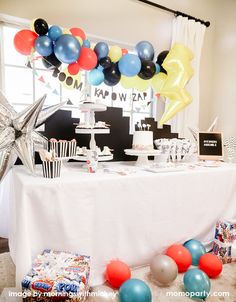 a birthday party with balloons and streamers