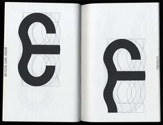 an open book with black and white designs on it's pages, including the letter e