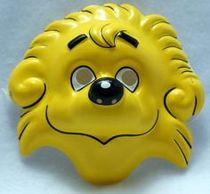 a yellow animal mask with eyes and nose