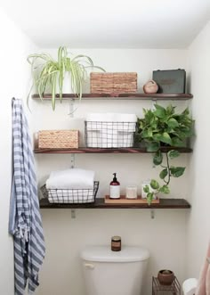 the bathroom is clean and ready to be used as a place for towels, toilet paper, and other items