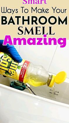 a person in blue gloves is cleaning a bathtub with a yellow spray bottle and the words smart ways to make your bathroom smell amazing