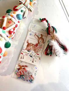 some christmas decorations are sitting on a table next to a package of candy canes