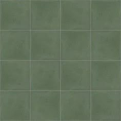 a green tile wall with square tiles on it