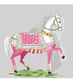 a pink and white horse wearing a colorful blanket