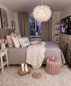 the bedroom is decorated in neutral tones with pink accents and white accessories on the bed