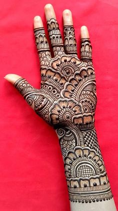 the hand is decorated with intricate designs