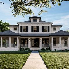 a white two story house with black shutters