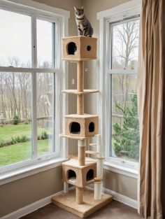 a cat sitting on top of a scratching tower