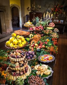 a long table filled with lots of different types of food on it's sides