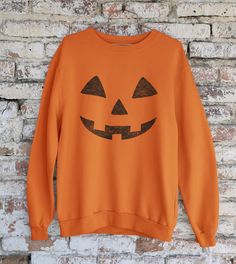 Wear this fun Halloween Pumpkin Face Sweatshirt to a party or when you trick-or-treat! Halloween Pumpkin Face Sweatshirt, Pumpkin Jack-O-Lantern Print Scary Sweatshirt, Happy Halloween Sweater Gift .: Loose fit .: 50% Cotton; 50% Polyester (fibre content may vary for different colors) .: Medium fabric (8.0 oz/yd² (271.25 g/m .: Sewn in label .: Runs true to size FINER DETAILS * Printed on super soft premium material * Designed in the U.S.A. * Made to last PROPER SIZING Please see photos to see the specific sizing chart for this clothing item. Our shirts are unisex size, meaning they are not women's fitted shirts. If would like a more fitted look, we suggest that you size down. To get your size, lay your favorite shirt at home flat, measure armpit to armpit, and then compare to the size cha Fitted Shirts, Pumpkin Sweatshirts, Pumpkin Face, Pumpkin Jack, Halloween Sweater, Pumpkin Faces, Sweater Gift, Halloween Pumpkin, Favorite Shirts