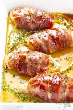 bacon wrapped in cheese and garnished with herbs